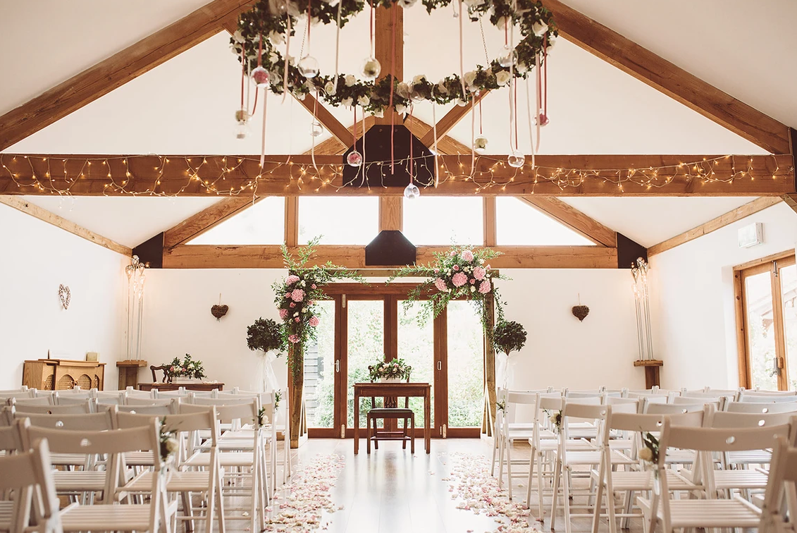 Jonathan and Louise working as a Maidens Barn Wedding Videographer at the restored barn in Essex