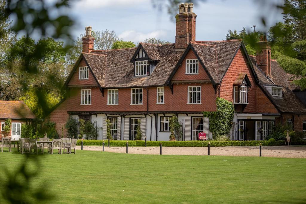 Jonathan and Louise working as a Ravenwood Hall Hotel Wedding Videographer at the historic Tudor manor in Suffolk